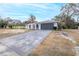 House exterior with driveway and landscaping at 6166 Newmark St, Spring Hill, FL 34606