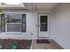 Front door entry with black shutters at 6166 Newmark St, Spring Hill, FL 34606