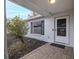 Front porch with tiled flooring and landscaping at 6166 Newmark St, Spring Hill, FL 34606
