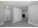 Hallway with neutral paint and double door closet at 6166 Newmark St, Spring Hill, FL 34606