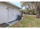 Exterior view of house with AC unit at 6166 Newmark St, Spring Hill, FL 34606