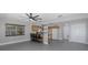 Open kitchen with oak cabinets and view to living area at 6166 Newmark St, Spring Hill, FL 34606