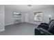Living room featuring a large TV and comfortable seating at 6166 Newmark St, Spring Hill, FL 34606
