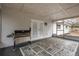 Covered patio with a built-in grill and French doors at 6166 Newmark St, Spring Hill, FL 34606