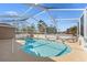 Refreshing kidney-shaped pool with screened enclosure at 7023 Orinoco Rd, Weeki Wachee, FL 34613