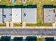 Aerial view showing multiple buildings and rooftops at 7037 Versailles N # 15, Pinellas Park, FL 33781