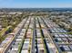 Aerial view of community, showing numerous homes and landscaping at 7037 Versailles N # 15, Pinellas Park, FL 33781