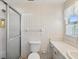 Bathroom with shower, toilet, sink, and vintage wallpaper at 7037 Versailles N # 15, Pinellas Park, FL 33781