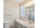 Bathroom with sink, toilet, and shower at 7037 Versailles N # 15, Pinellas Park, FL 33781