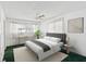 Bedroom with a large bed and green carpet at 7037 Versailles N # 15, Pinellas Park, FL 33781