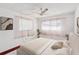 Bright bedroom with neutral tones and window coverings at 7037 Versailles N # 15, Pinellas Park, FL 33781