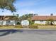 Welcome Village 55+ community sign in front of two houses at 7037 Versailles N # 15, Pinellas Park, FL 33781