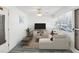 Living room with sectional sofa and a large TV at 7037 Versailles N # 15, Pinellas Park, FL 33781