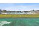 Community pool with surrounding lawn and fence at 7037 Versailles N # 15, Pinellas Park, FL 33781