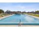 Refreshing community swimming pool with surrounding patio at 7037 Versailles N # 15, Pinellas Park, FL 33781