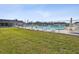 Relaxing community pool area with grassy lawn at 7037 Versailles N # 15, Pinellas Park, FL 33781