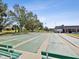 Expansive shuffleboard courts in a sunny outdoor space at 7037 Versailles N # 15, Pinellas Park, FL 33781