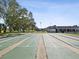 Community shuffleboard courts with benches and trees at 7037 Versailles N # 15, Pinellas Park, FL 33781