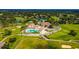 Aerial view of community with clubhouse, pool, and golf course at 7267 Prince George Ct, Spring Hill, FL 34606