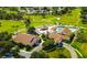 Aerial view showing community clubhouse, pool, and golf course at 7267 Prince George Ct, Spring Hill, FL 34606