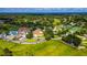 Aerial view of community with clubhouse, pool, golf course, and tennis courts at 7267 Prince George Ct, Spring Hill, FL 34606