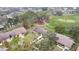 Aerial view of townhouses nestled amongst lush green golf course at 7267 Prince George Ct, Spring Hill, FL 34606