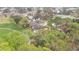Aerial view of a community of townhouses near a golf course at 7267 Prince George Ct, Spring Hill, FL 34606