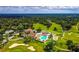 Aerial view of community clubhouse, pool, and golf course at 7267 Prince George Ct, Spring Hill, FL 34606