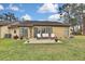 Private backyard with patio and beautiful landscaping at 7267 Prince George Ct, Spring Hill, FL 34606