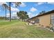 Spacious backyard with patio, lush lawn, and golf course view at 7267 Prince George Ct, Spring Hill, FL 34606