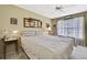 Spacious bedroom with king-size bed and ample natural light at 7267 Prince George Ct, Spring Hill, FL 34606