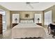 Main bedroom with king-size bed and ensuite bathroom at 7267 Prince George Ct, Spring Hill, FL 34606