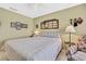 Bright bedroom with a queen-size bed and ceiling fan at 7267 Prince George Ct, Spring Hill, FL 34606