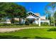 Elegant clubhouse entrance with landscaping and covered entryway at 7267 Prince George Ct, Spring Hill, FL 34606