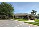 Community building with ample parking and landscaped grounds at 7267 Prince George Ct, Spring Hill, FL 34606