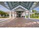 Elegant clubhouse entrance with brick pavers at 7267 Prince George Ct, Spring Hill, FL 34606