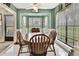 Bright dining area with wood table and chairs, overlooking a scenic view at 7267 Prince George Ct, Spring Hill, FL 34606