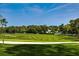 Expansive green golf course with sand traps and trees at 7267 Prince George Ct, Spring Hill, FL 34606