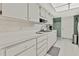 White kitchen with ample counter space and cabinets at 7267 Prince George Ct, Spring Hill, FL 34606