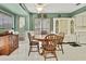 Cozy eat-in kitchen with wood table and built-in hutch at 7267 Prince George Ct, Spring Hill, FL 34606