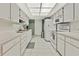 Clean and spacious kitchen with white cabinets and appliances at 7267 Prince George Ct, Spring Hill, FL 34606