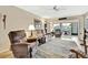 Relaxing living room with access to a sunroom and neutral decor at 7267 Prince George Ct, Spring Hill, FL 34606