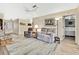Bright living room with comfy seating and wood-look floors at 7267 Prince George Ct, Spring Hill, FL 34606