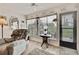 Bright sunroom with view of backyard and access to outdoors at 7267 Prince George Ct, Spring Hill, FL 34606