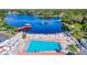 Community pool with lake view and a gazebo at 8210 Sulky Ct # 5, Port Richey, FL 34668