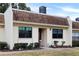 Front view of charming condo with well-maintained landscaping at 8210 Sulky Ct # 5, Port Richey, FL 34668