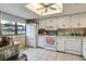 Bright kitchen featuring white appliances and ample counter space at 8210 Sulky Ct # 5, Port Richey, FL 34668