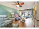 Relaxing living room with wood-look floors and access to patio at 8210 Sulky Ct # 5, Port Richey, FL 34668