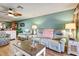 Cozy living room with light blue walls and recliner sofas at 8210 Sulky Ct # 5, Port Richey, FL 34668