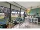 Bright sunroom with comfy seating and a built-in bar at 8210 Sulky Ct # 5, Port Richey, FL 34668